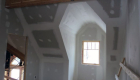 Finishing the interior walls on the second story.