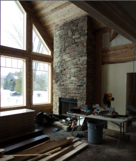 Stonework completed on the fireplace.