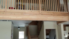 A view of the loft and staircase from the main floor of the great room.