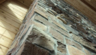 A different perspective on the height of this great room. The natural stone in the fireplace complements the warmth of the wood.