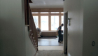 A peek through the hallway to the great room. Note how the natural light really fills the room.