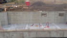 Basement walls and slab poured. Roughed in plumbing completed.