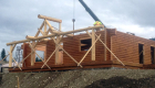 Log porch completed. Ridge beam being put in place.