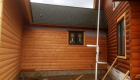 Siding and window trim being installed -- yet to be stained.