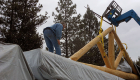Note the need for specialty handling aids on this large handcrafted entry truss for the porch.