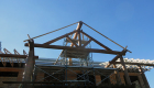 The log porch and roof system under construction.