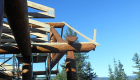 The log porch and roof system under construction.