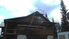 Gable end siding being installed -- note the scaffolding 5 high!!