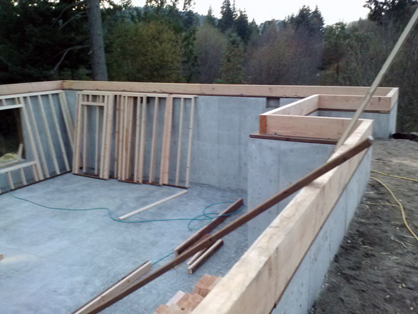 Basement wall framing under construction.