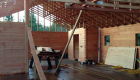 Roof trusses and interior framing completed.