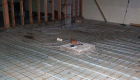 Radiant heat system being installed in basement floor.