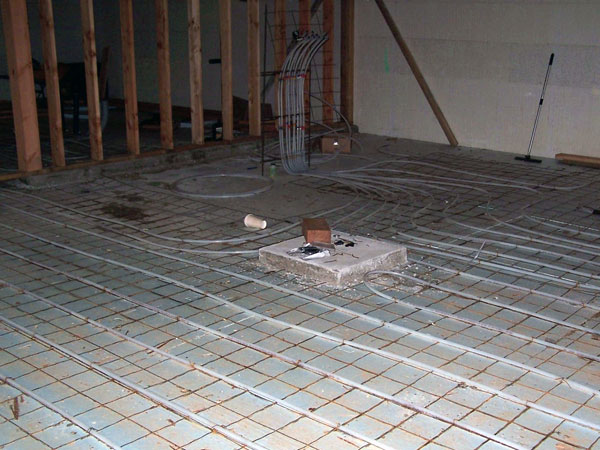 Radiant heat system being installed in basement floor.