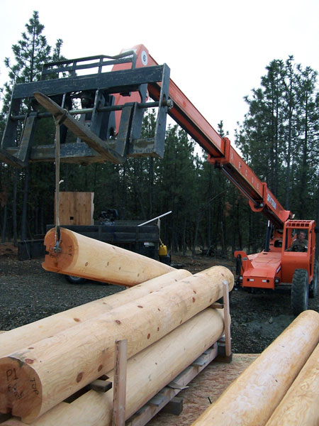 Start of log stack, 1st vertical corner being prepared.