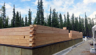 Pre-cut, pre-drilled log wall system -- saves considerable man hours on site.