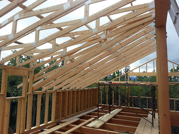 Upper floor pony wall and roof framing.