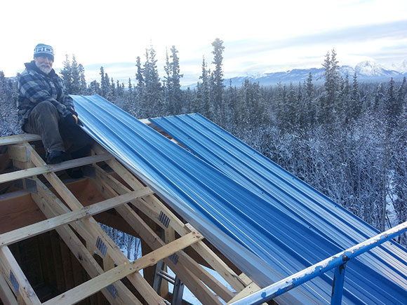 Metal roof under construction on a sunny winter day.